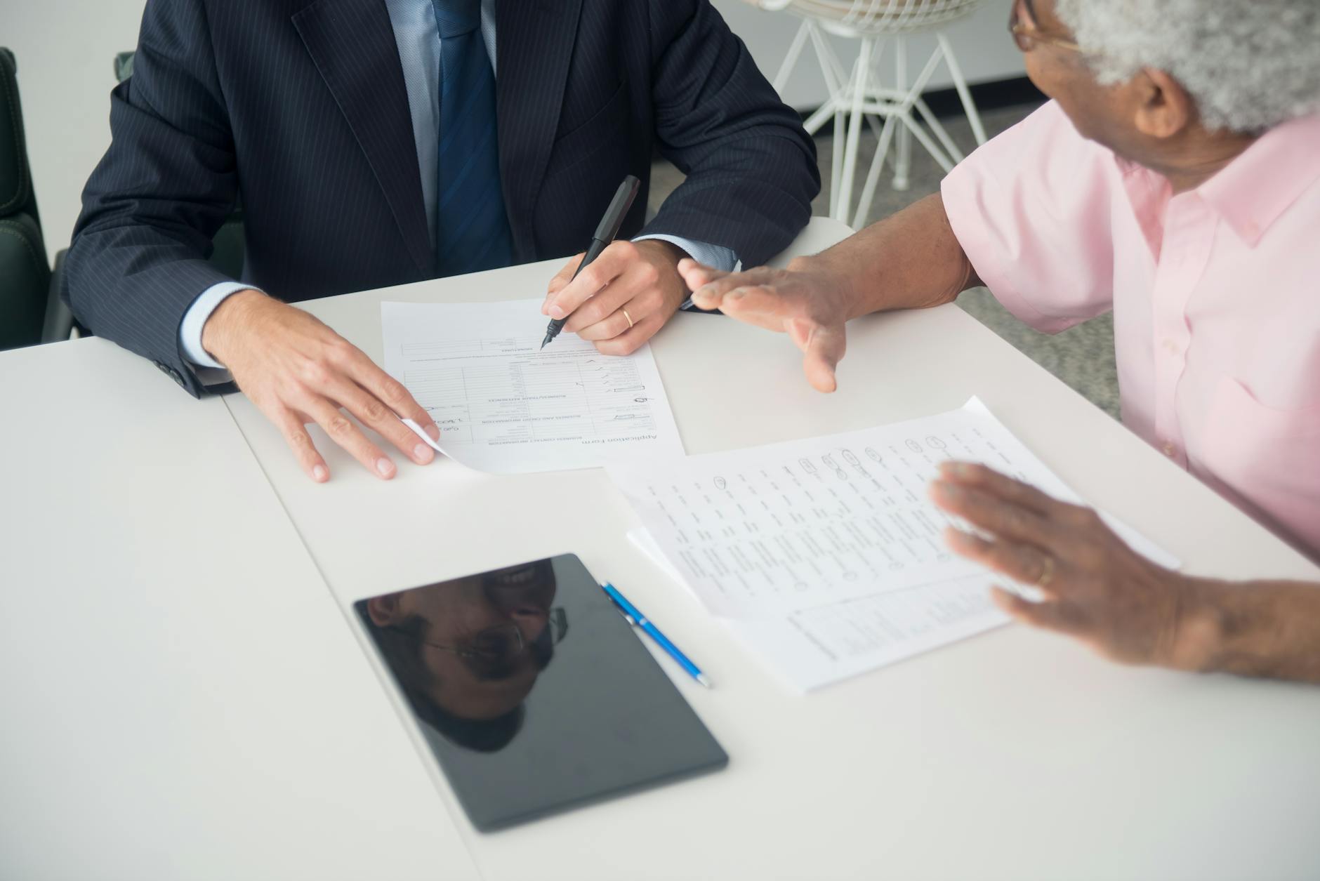 Financial advisor discussing investment options with an older client