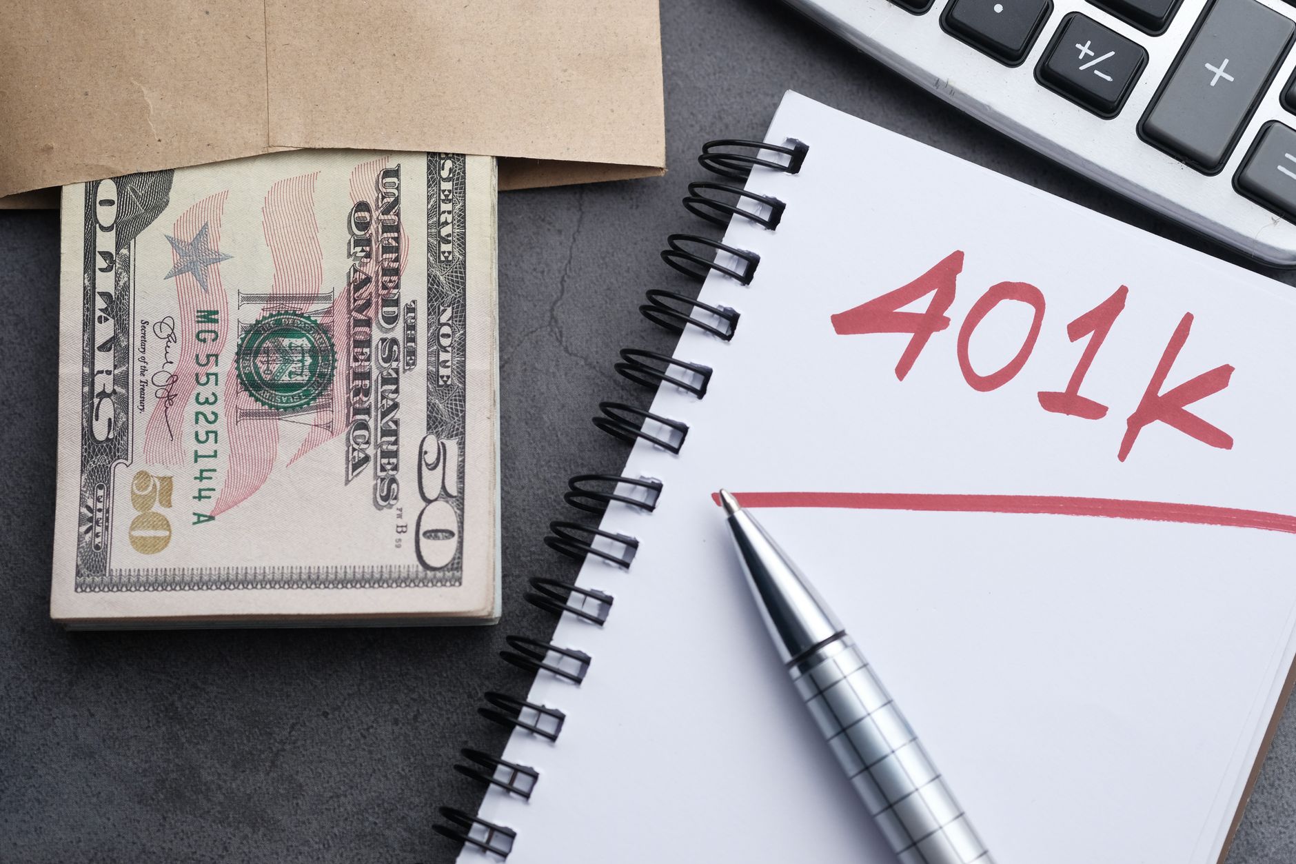 Professional reviewing income investment strategy documents at an office desk