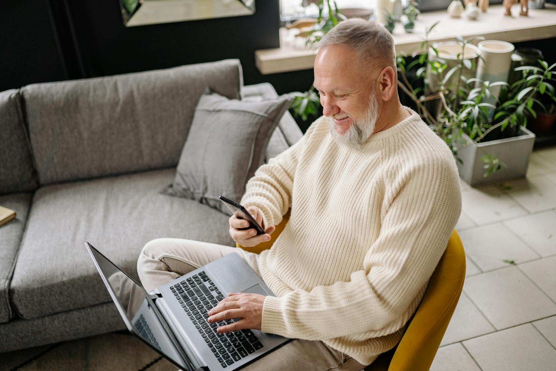 An older adult reviewing investment portfolio and bond ladder strategy on a laptop at home