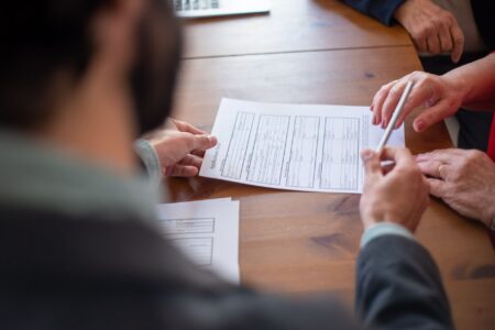 Reinsurance Sidecars Quietly Attract Institutional Capital Seekers Close-up of an insurance contract document on a desk, representing reinsurance agreements