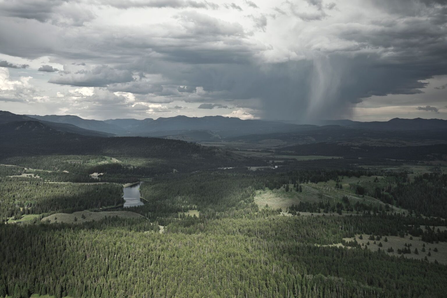 Catastrophe Bond Funds Quietly Attract Capital as Storm Losses Mount Dark storm clouds viewed from above representing catastrophic weather risk