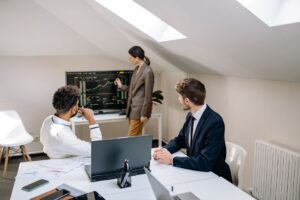 Investment professionals reviewing structured finance documents at a conference table