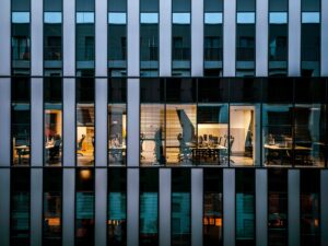 Equity REITs Quietly Regain Ground as Office Vacancies Stabilize Modern glass office building exterior reflecting city skyline