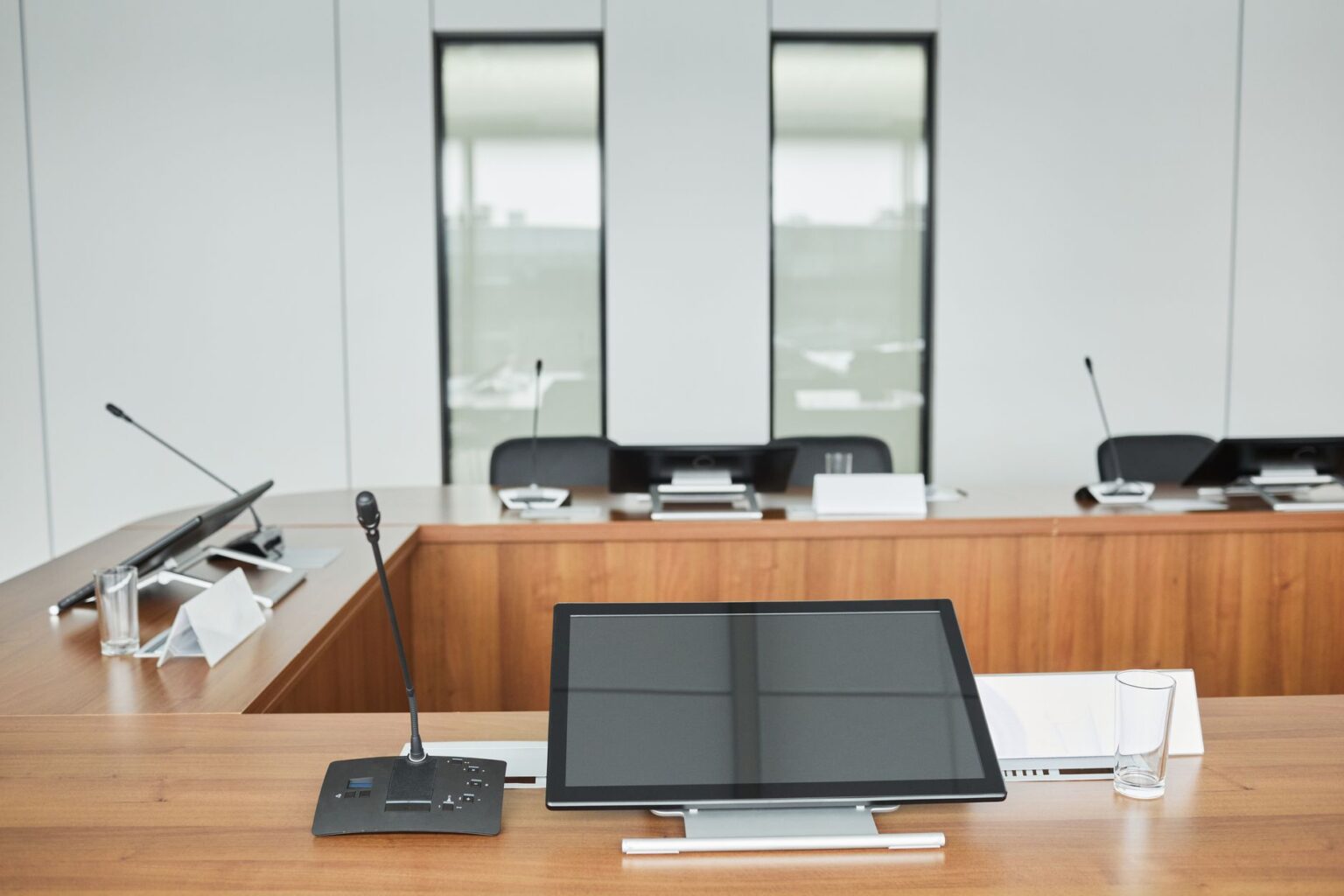Corporate boardroom table representing conglomerate strategy meetings and restructuring decisions