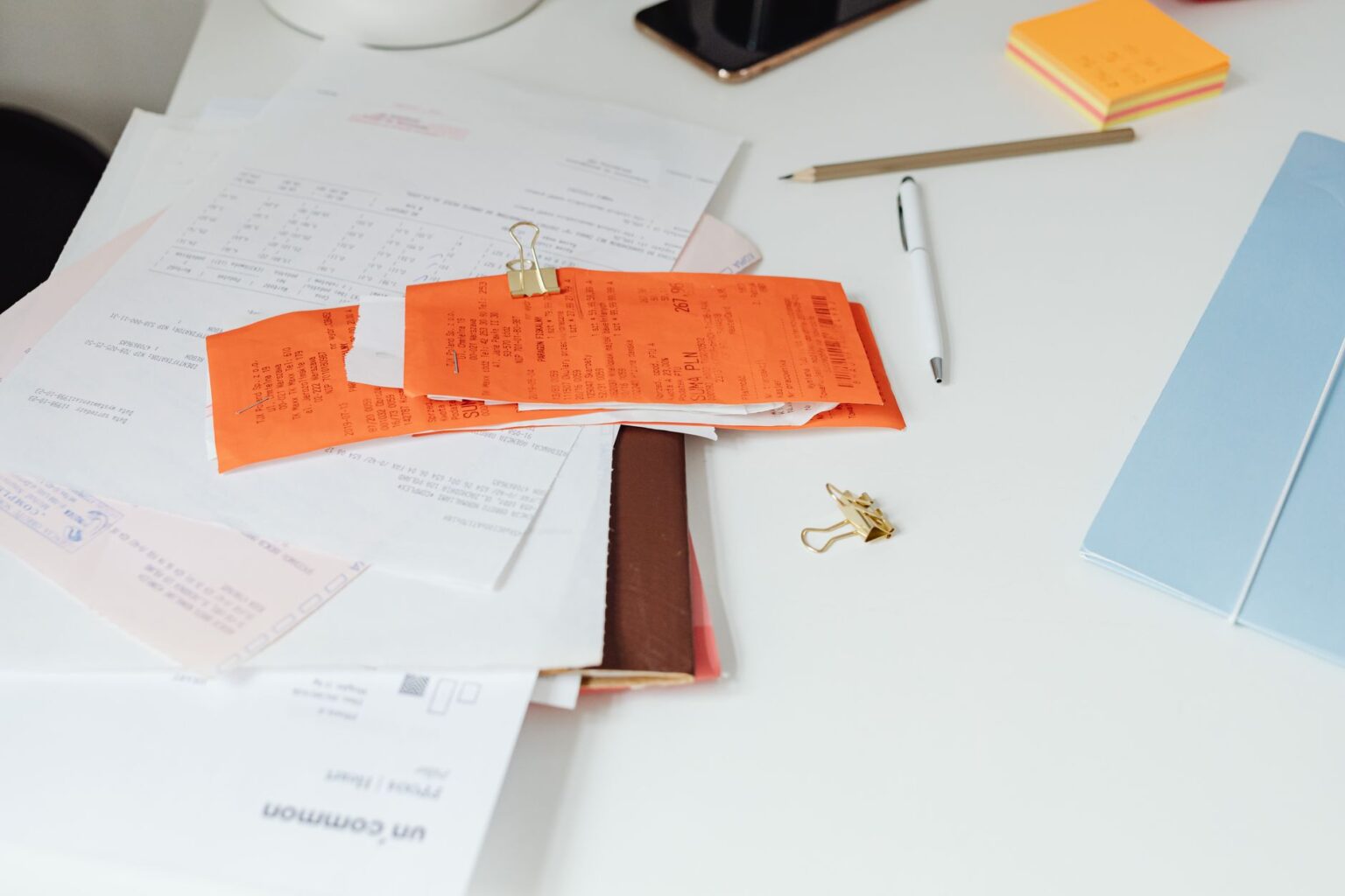 Secondaries Market Quietly Absorbs Illiquid Private Equity Stakes Financial documents and charts spread across a desk representing private equity fund analysis
