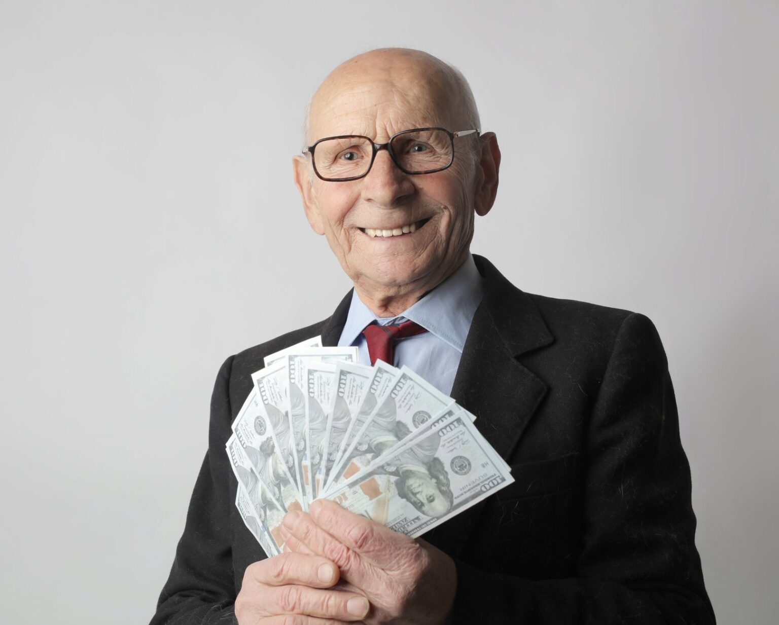 Longevity Annuities Quietly Gain Ground Among Late-Career Planners Senior couple reviewing financial documents at a desk, planning for retirement income