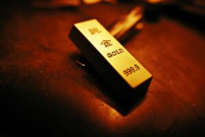 Stacked gold bars representing physical commodity holdings in real asset ETFs