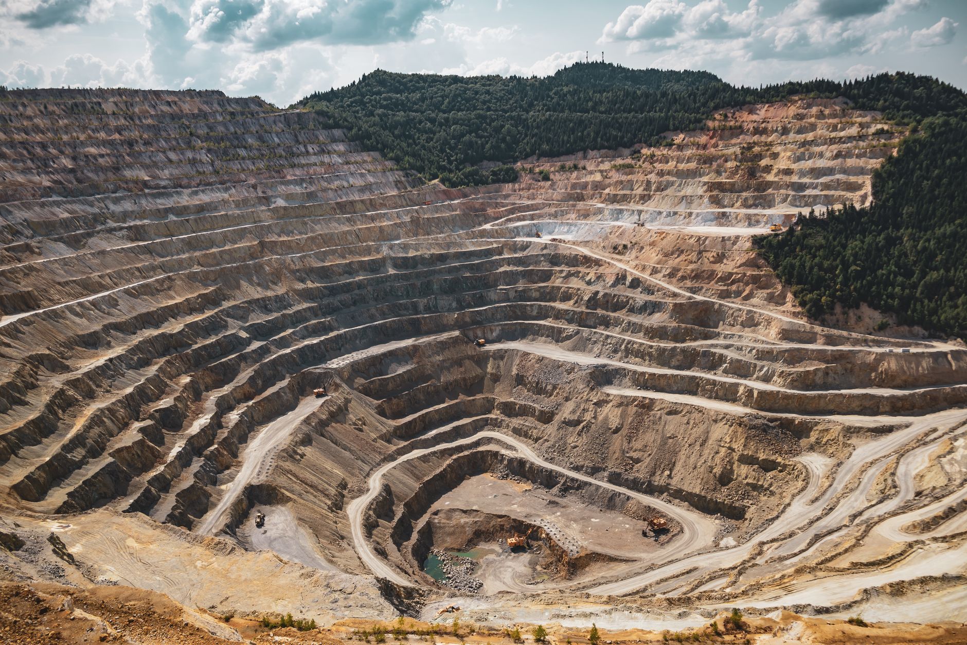 Large-scale copper mining operation with heavy industrial machinery