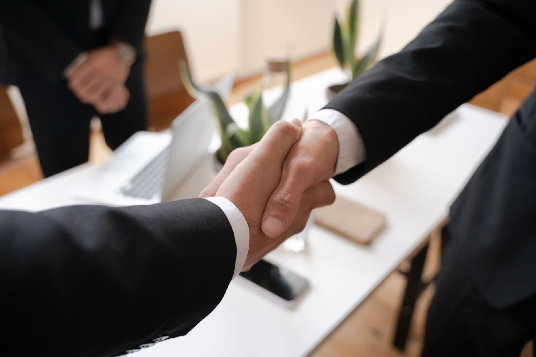 Business professionals reviewing documents during a corporate negotiation meeting