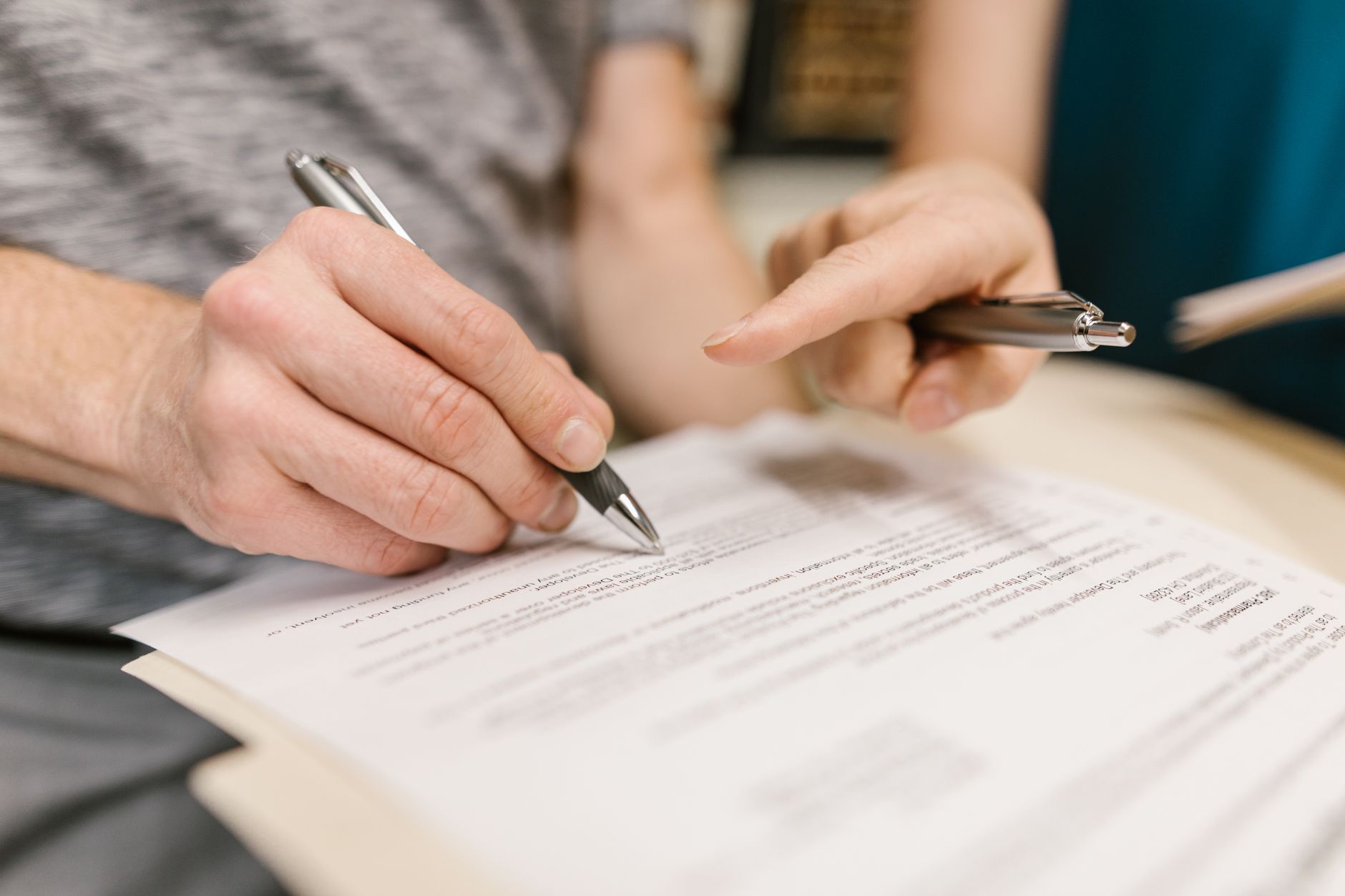 Close-up of financial investment documents and a calculator representing annuity fee analysis