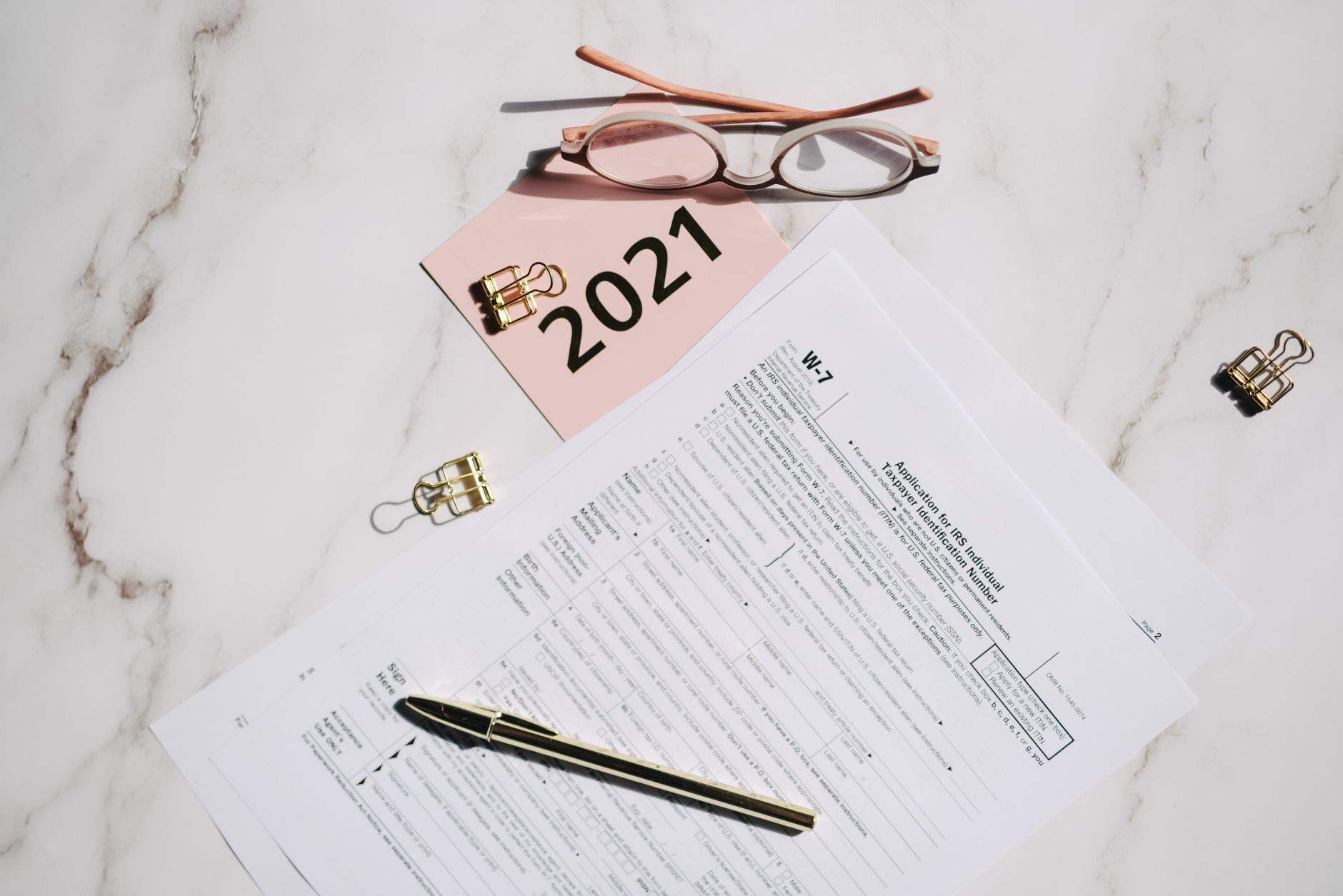 Tax planning documents spread on a desk representing state and federal tax strategy