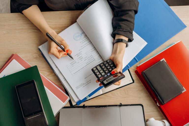 Collateralized Fund Obligations Quietly Draw Scrutiny Among LP Allocators Financial documents and investment paperwork spread across a desk representing structured finance analysis