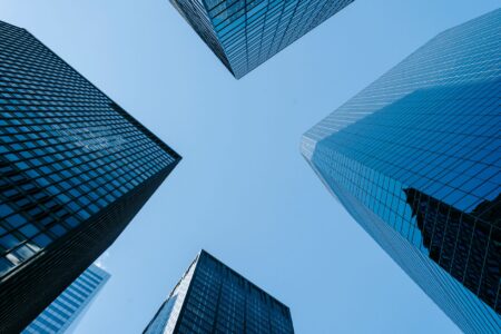 Financial charts and real estate investment documents on a desk