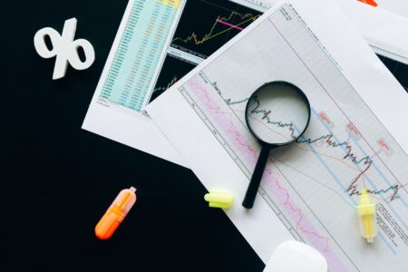 Financial analyst reviewing structured credit charts at a desk