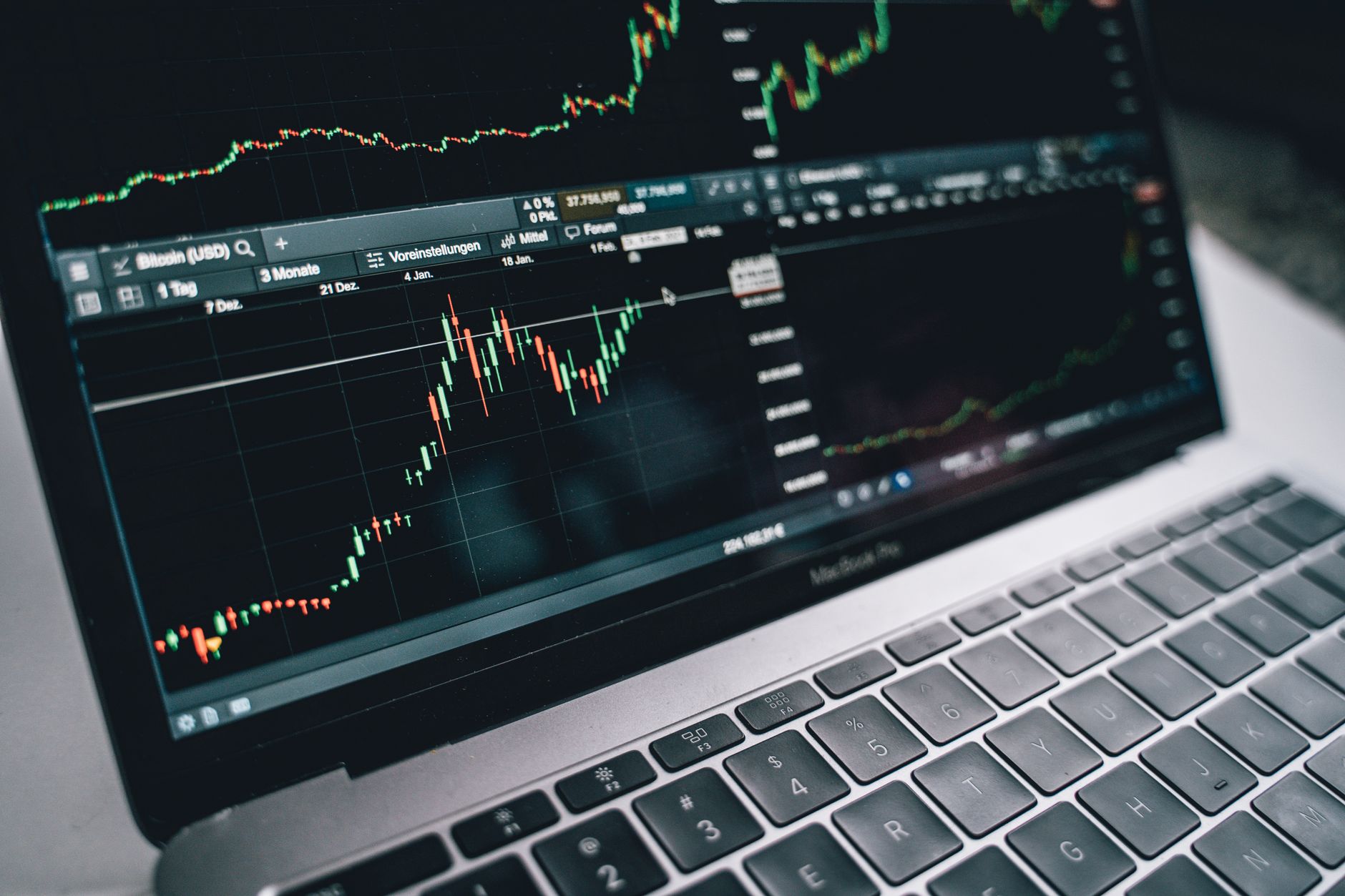 Traders monitoring screens on a busy bank trading floor representing credit market activity
