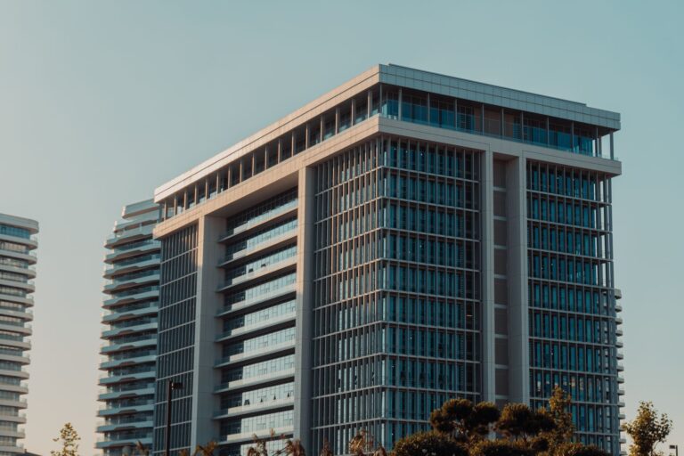 Modern commercial real estate building exterior representing REIT property assets