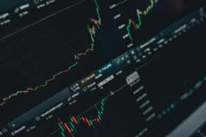 Financial charts showing stock market performance and income yield trends