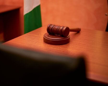 Litigation Finance Funds Quietly Attract Institutional Capital as Verdicts Grow Empty courtroom with wooden benches and judge's bench representing litigation finance investment