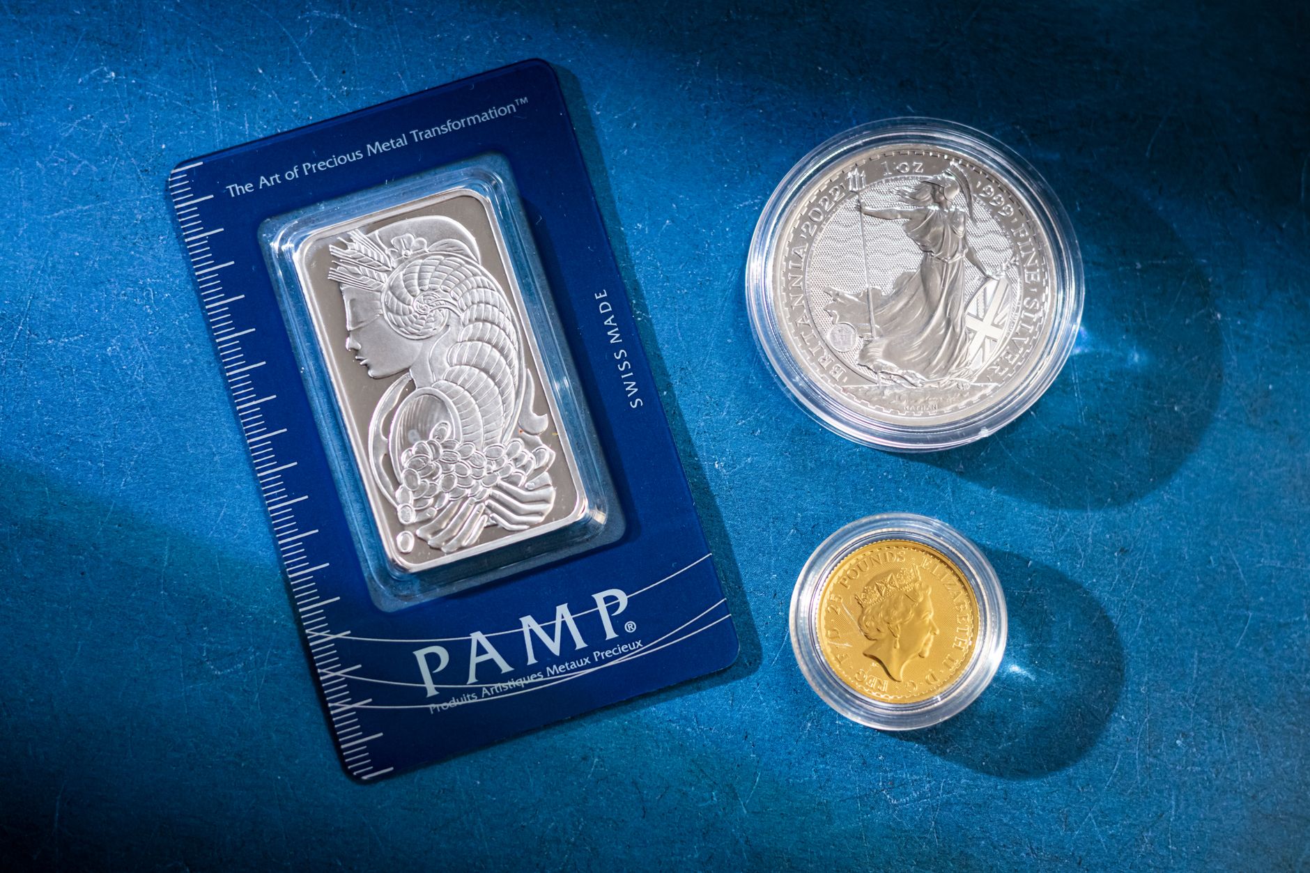 Stacked gold bars representing commodity royalty assets and streaming deal investments