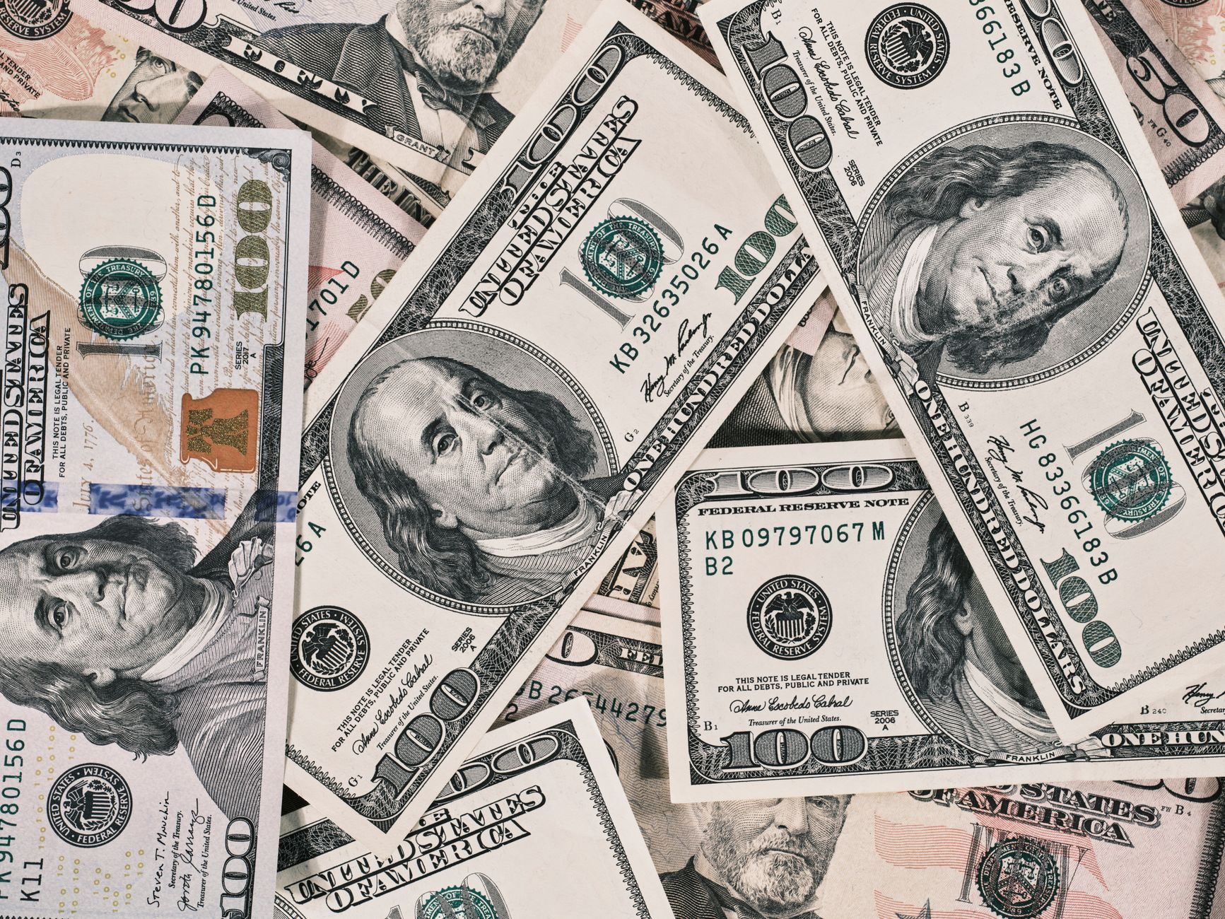 Stack of US dollar banknotes on a financial desk