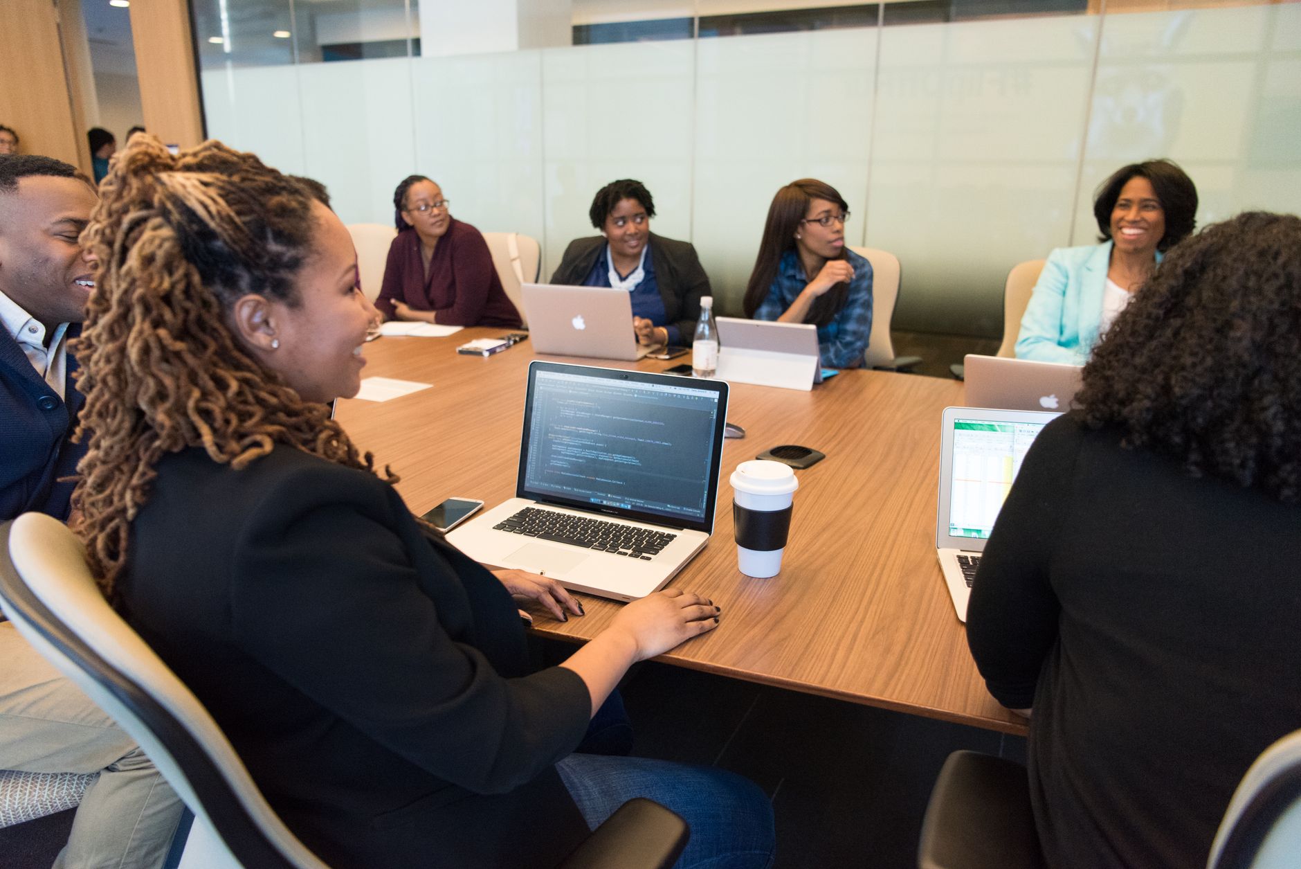 Corporate boardroom with executives seated around a conference table during a governance meeting