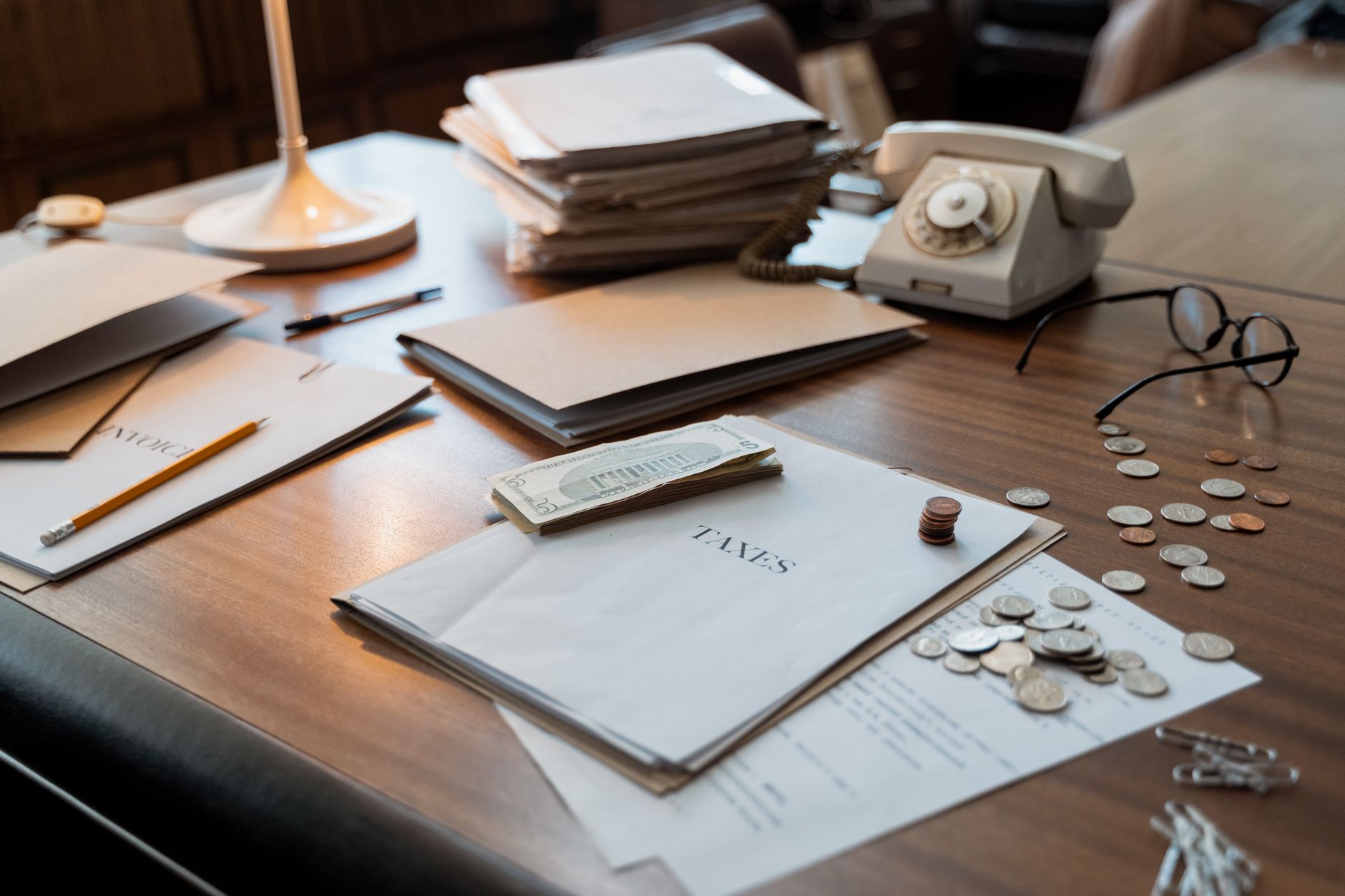 Tax policy documents and financial papers on a desk representing legislative impact on investments