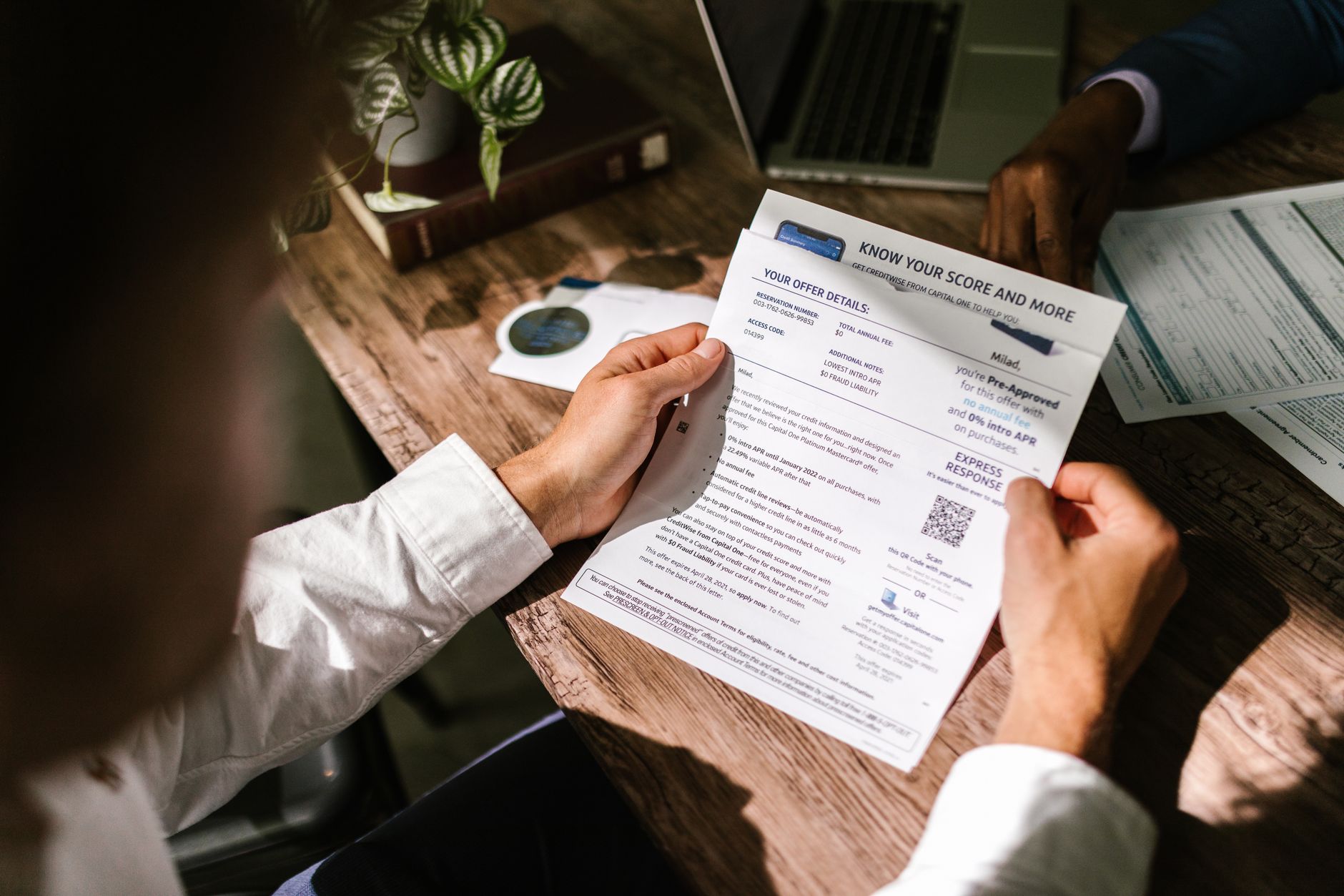 Business professionals reviewing investment data during a private meeting