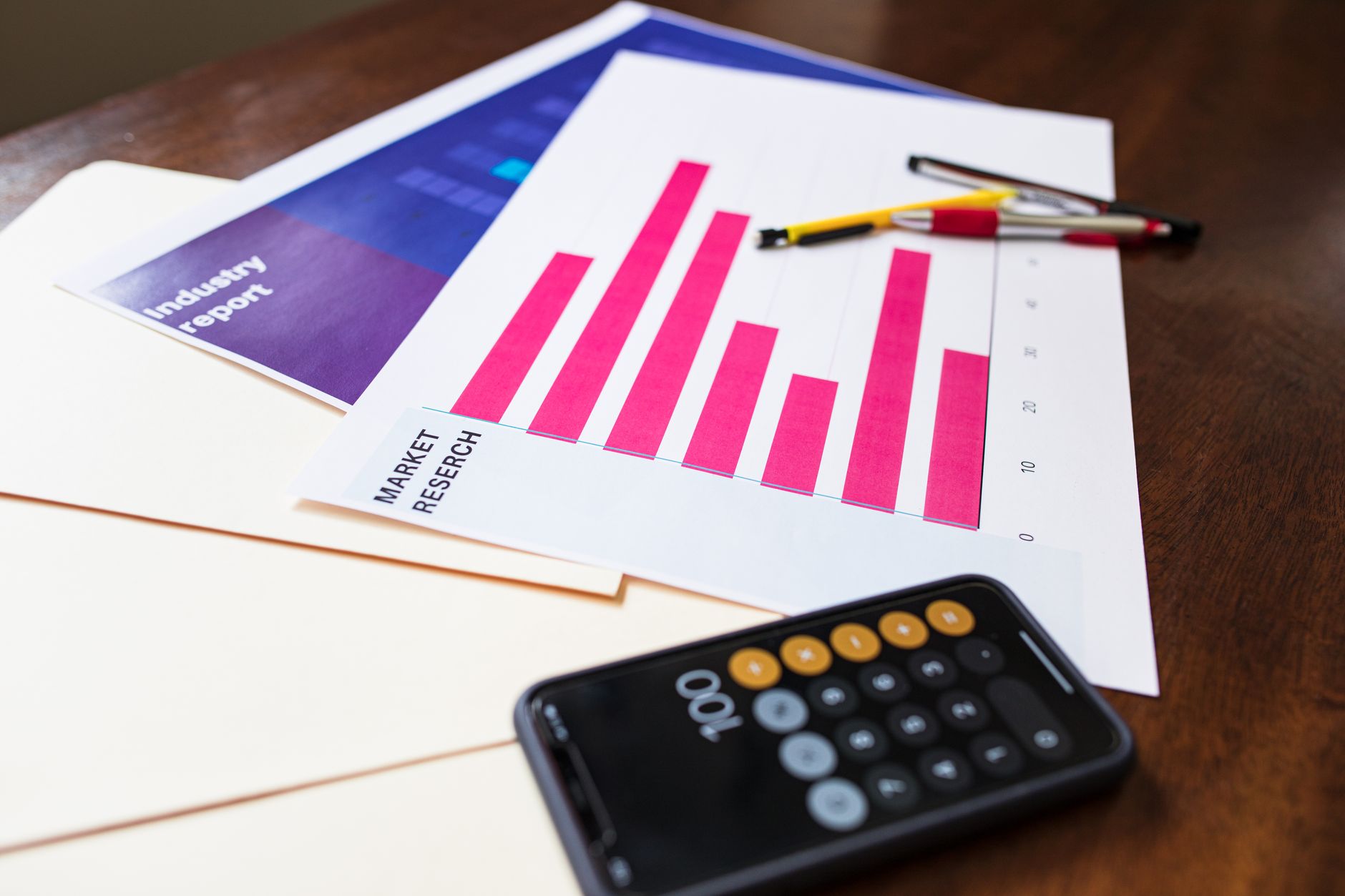 Financial analyst reviewing fixed-income charts and bond portfolio data at a desk