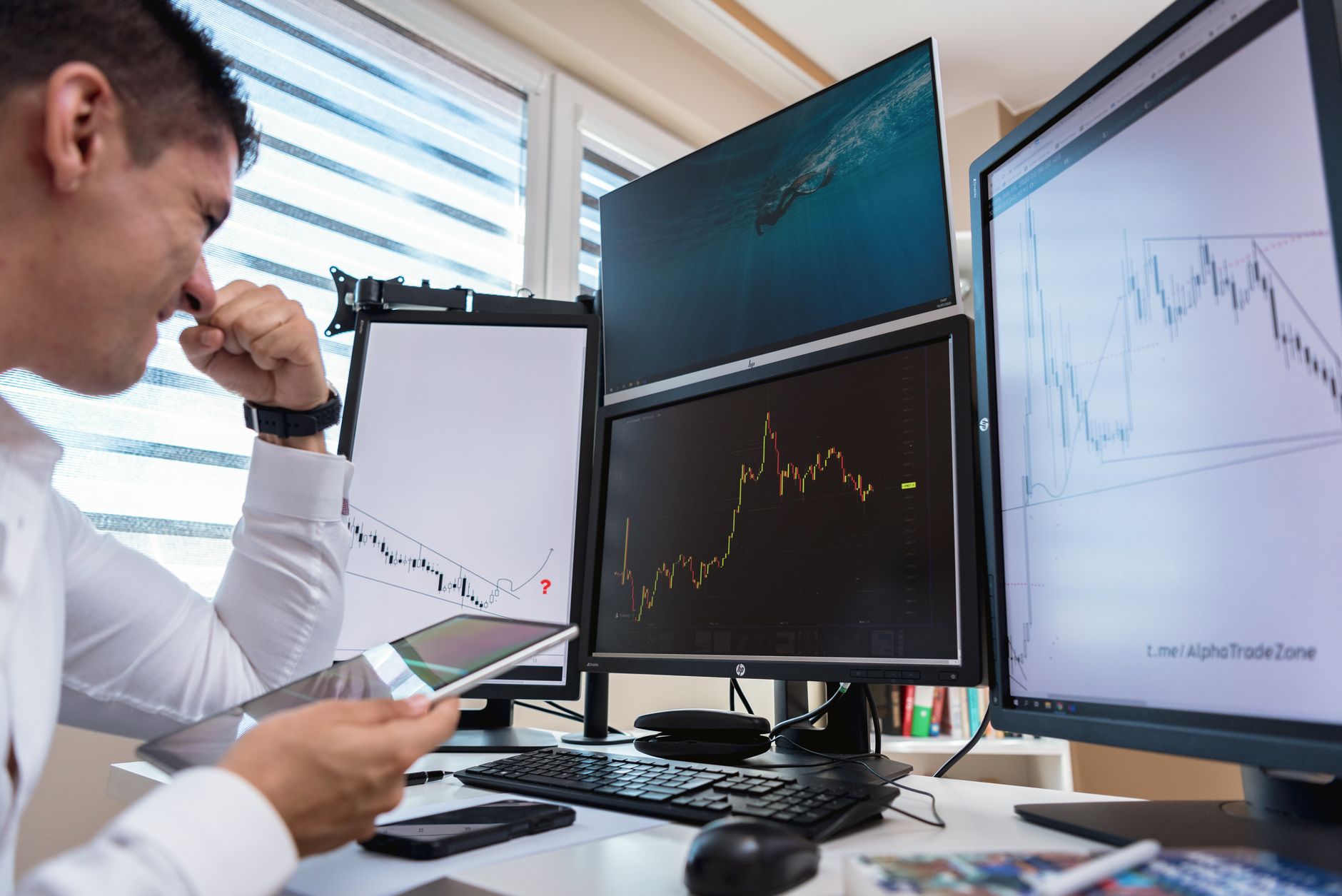 Institutional investor reviewing fixed income market analysis at a trading desk