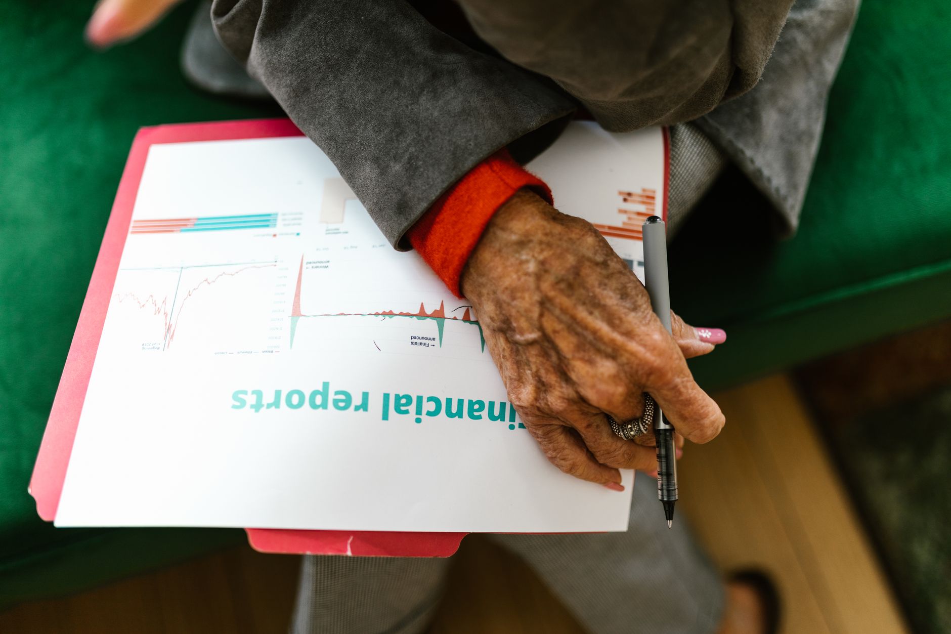 Investment portfolio documents spread across a desk during allocation review