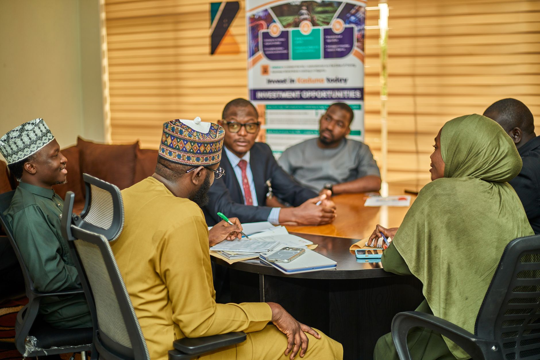 Institutional investors reviewing fixed-income portfolio documents in a meeting room