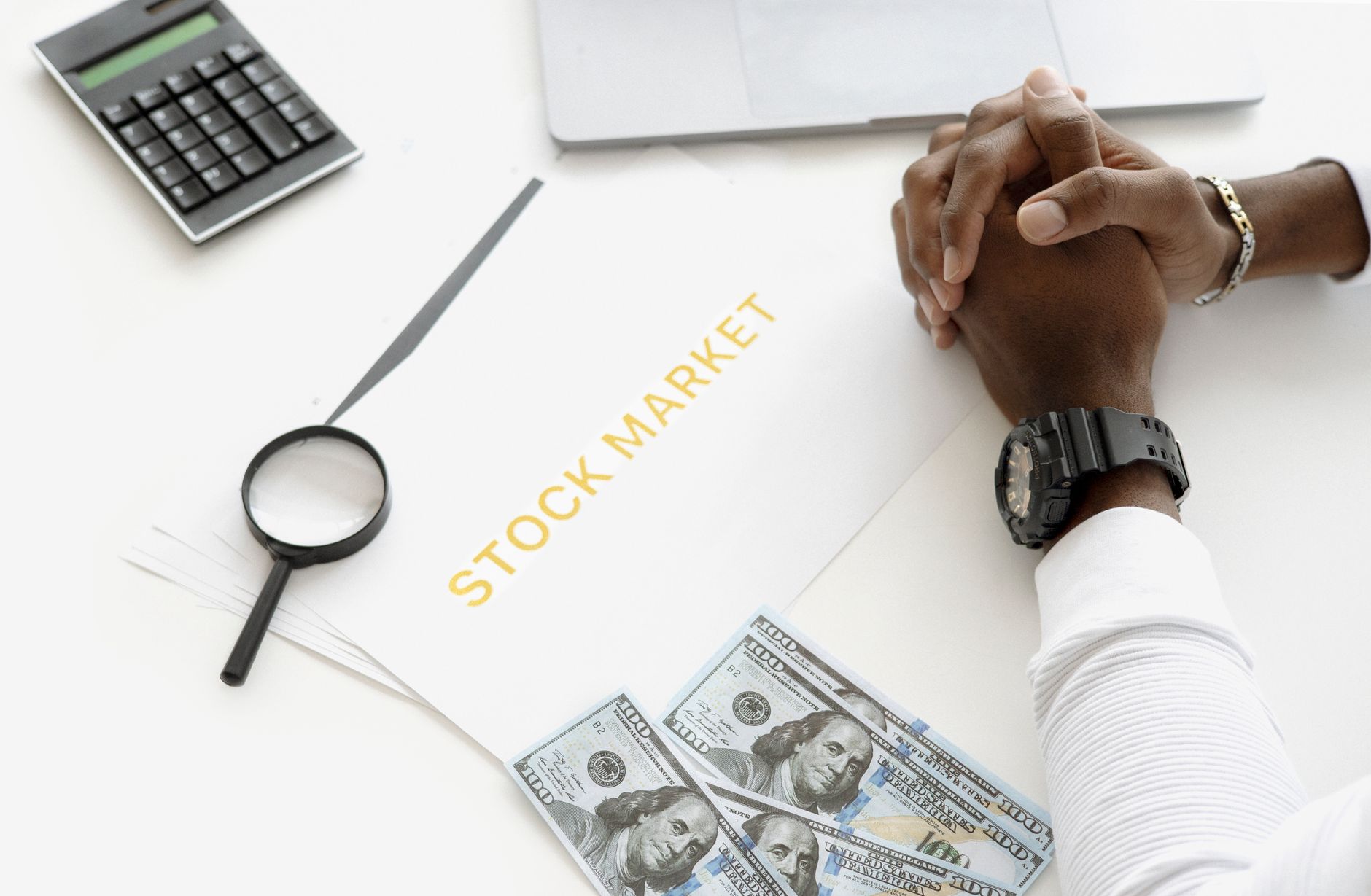 Financial analysts reviewing market data in a hedge fund office