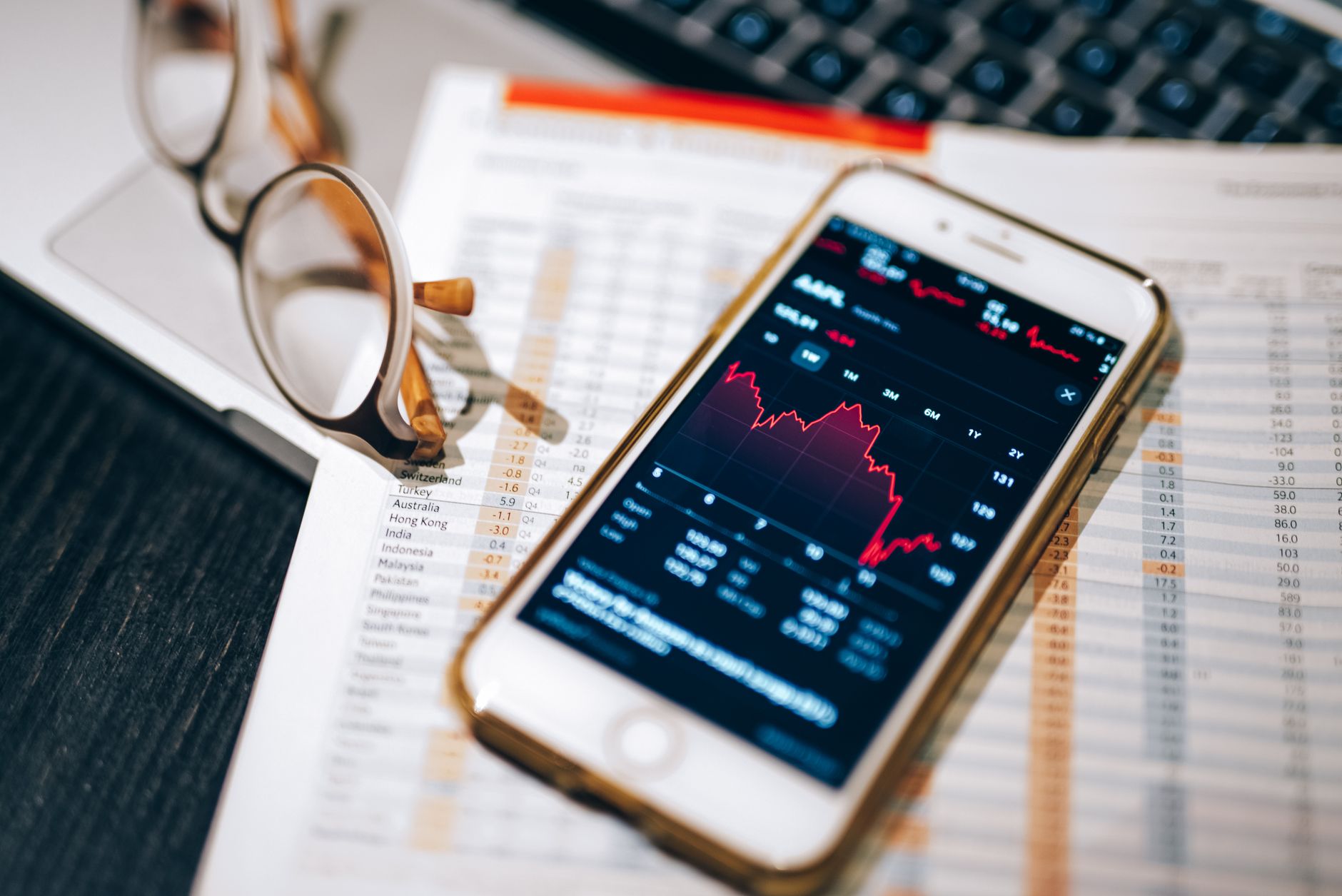 Investor reviewing closed-end fund portfolio documents at a desk