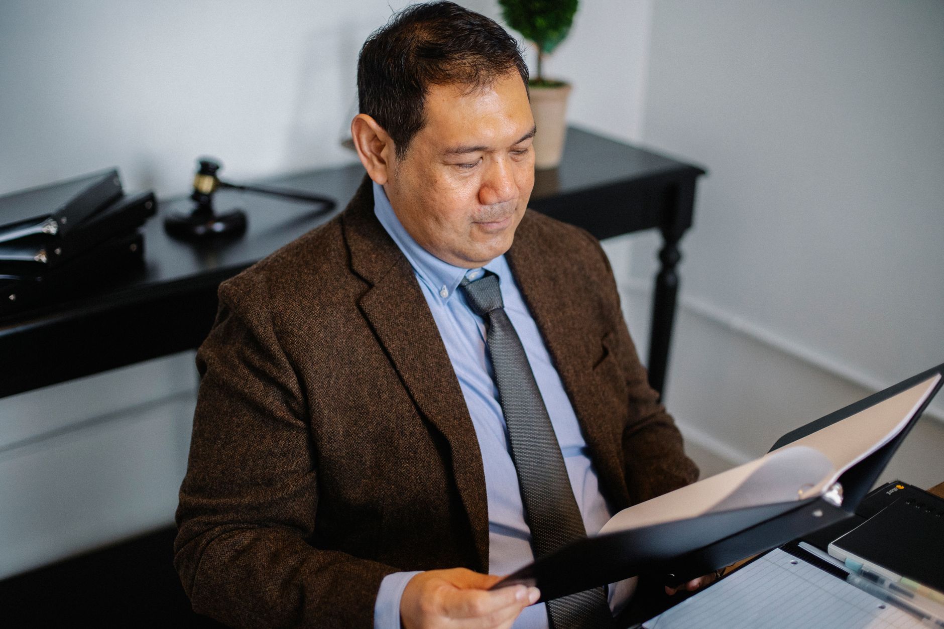 Investor reviewing ETF fund statements and distribution history at a desk