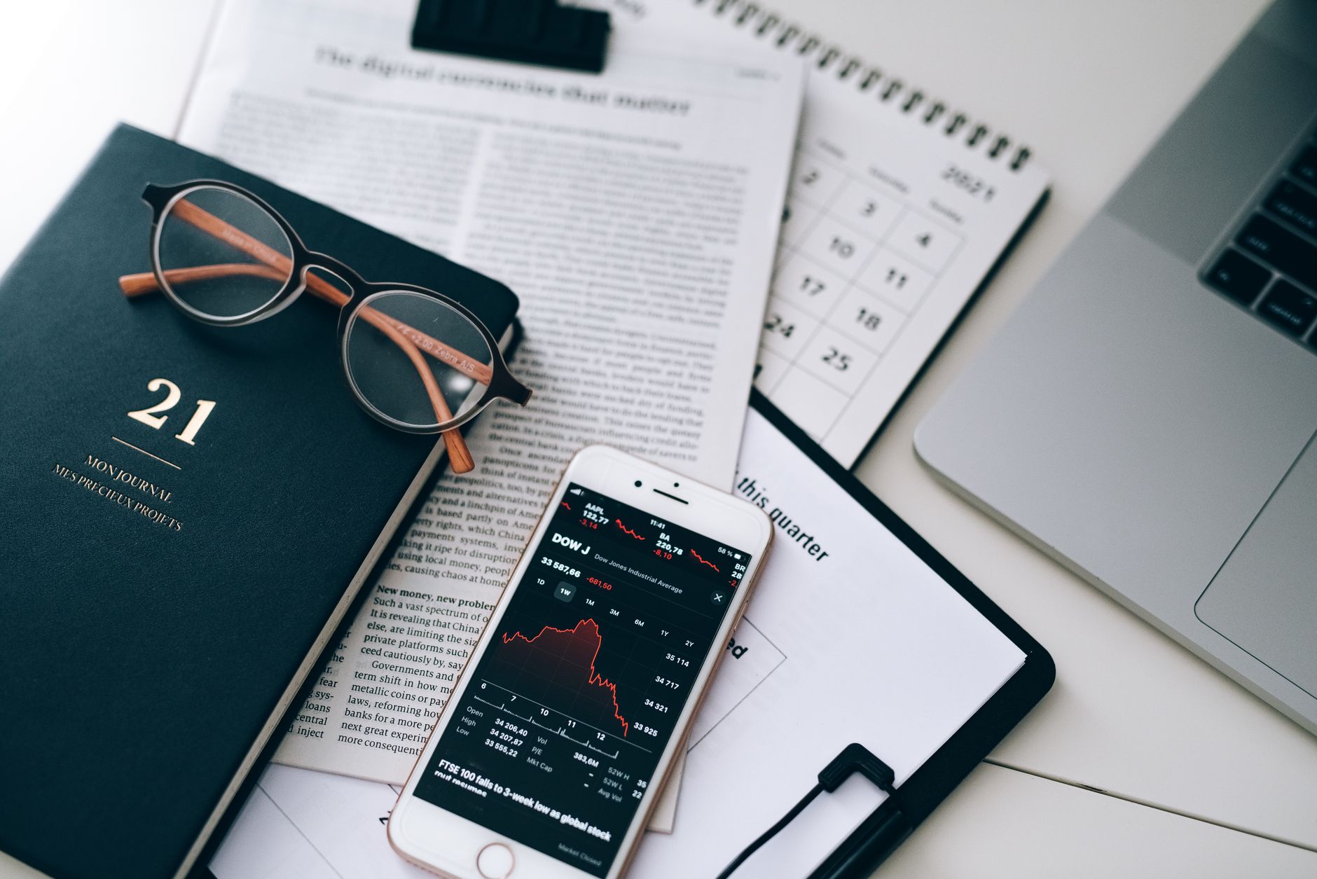 Financial planner reviewing tax strategy documents at a desk with calculator and charts