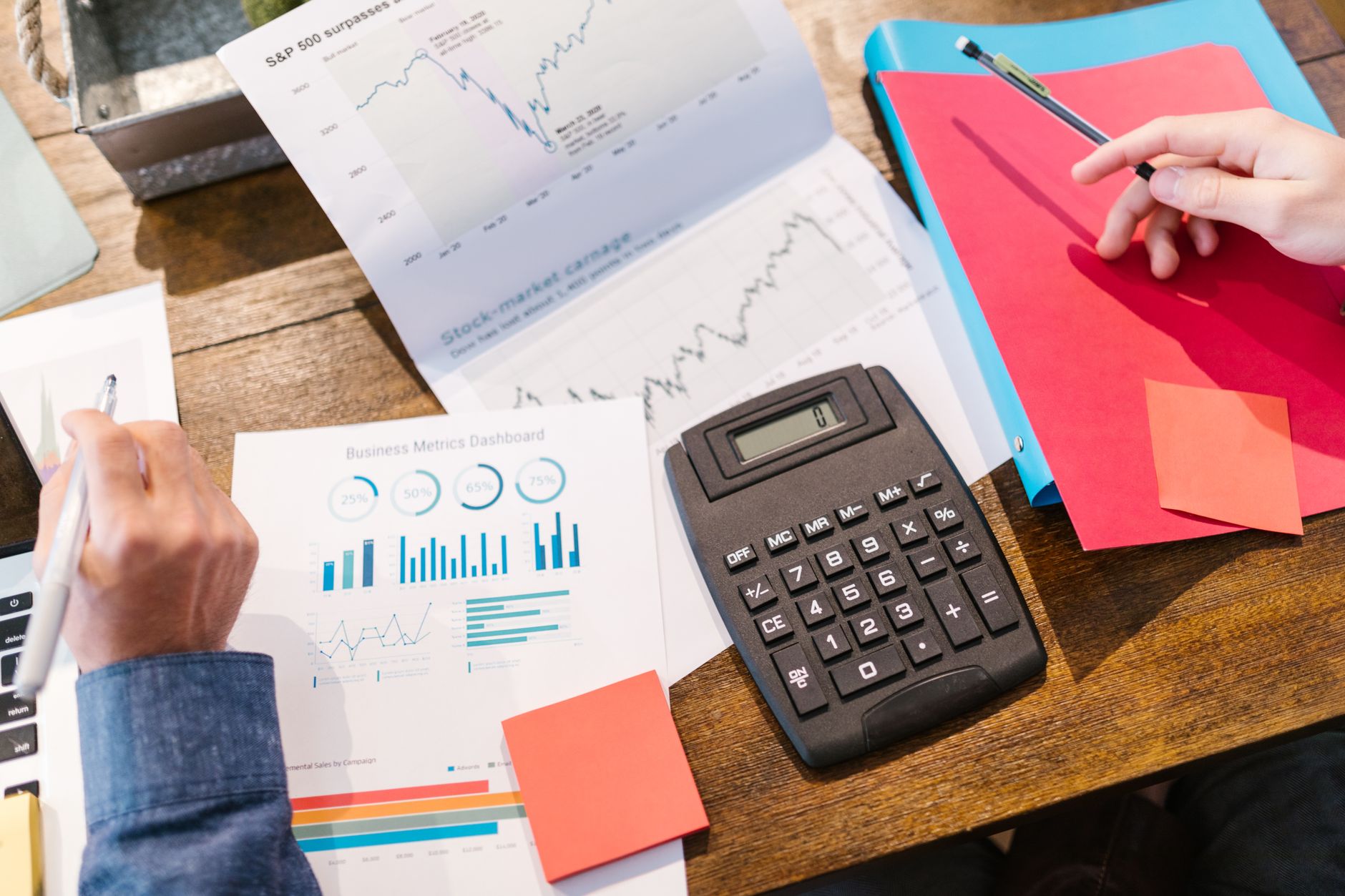 Investors reviewing portfolio documents related to alternative yield strategies