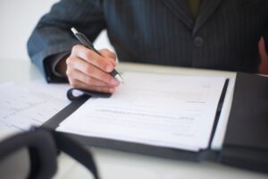 Financial documents and analysis papers spread across a desk representing structured credit research