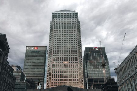 Closed-End Loan Participation Funds Quietly Narrow Discounts as Banks Tighten Exterior of a commercial bank building representing institutional lending and credit markets