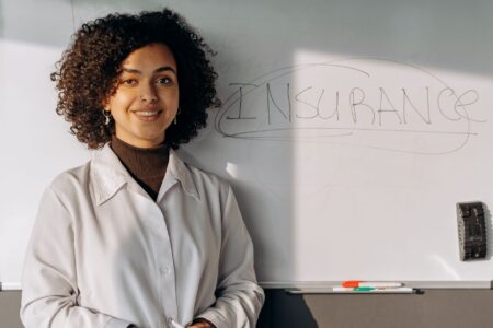 Senior Secured CLO Tranches Quietly Draw Insurance Allocators Insurance company office with professionals reviewing fixed income portfolio documents