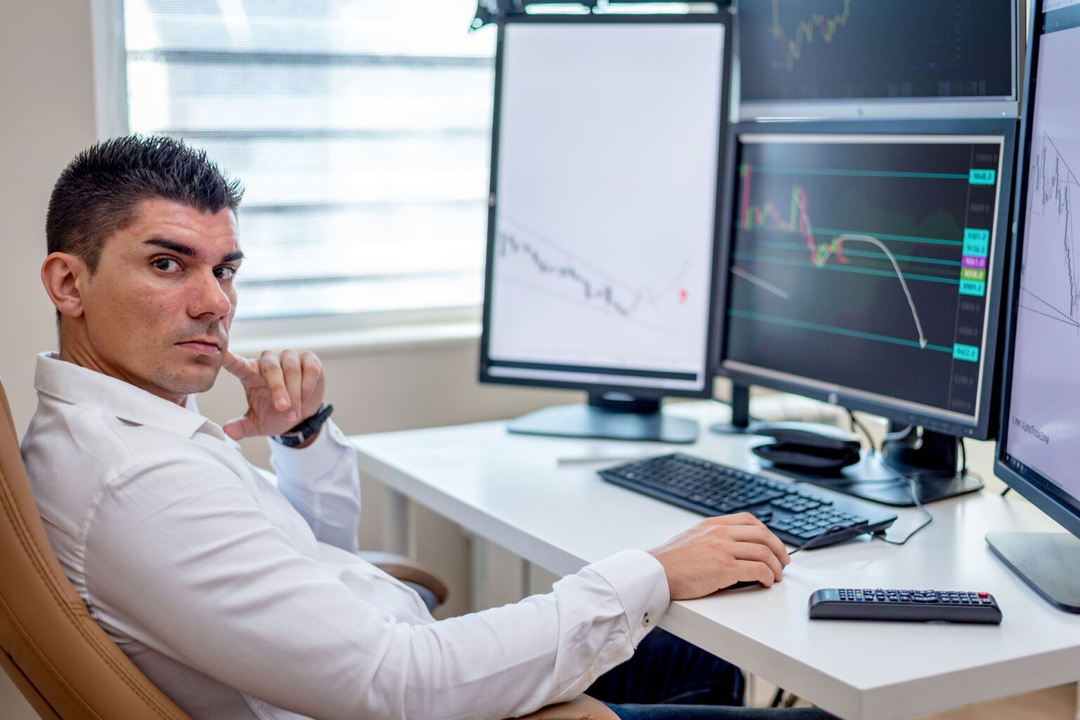 Volatility-Linked ETFs Quietly Draw Tactical Allocators as Hedges Reprice Multiple trading screens displaying stock market volatility data and ETF price movements
