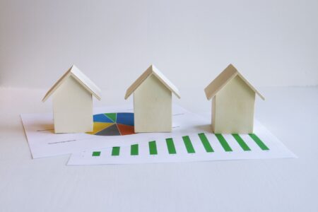 Financial documents and charts representing mortgage-backed securities and real estate investment trust analysis