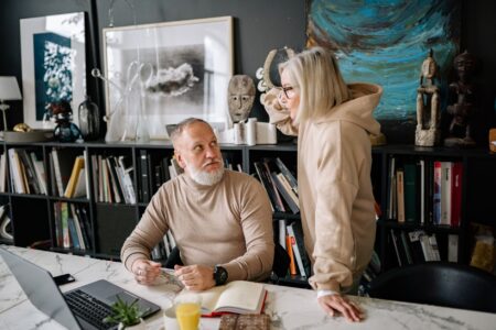Longevity-Linked Annuities Quietly Attract Aging Allocators as Lifespans Extend Older couple reviewing financial documents at a table, planning for retirement