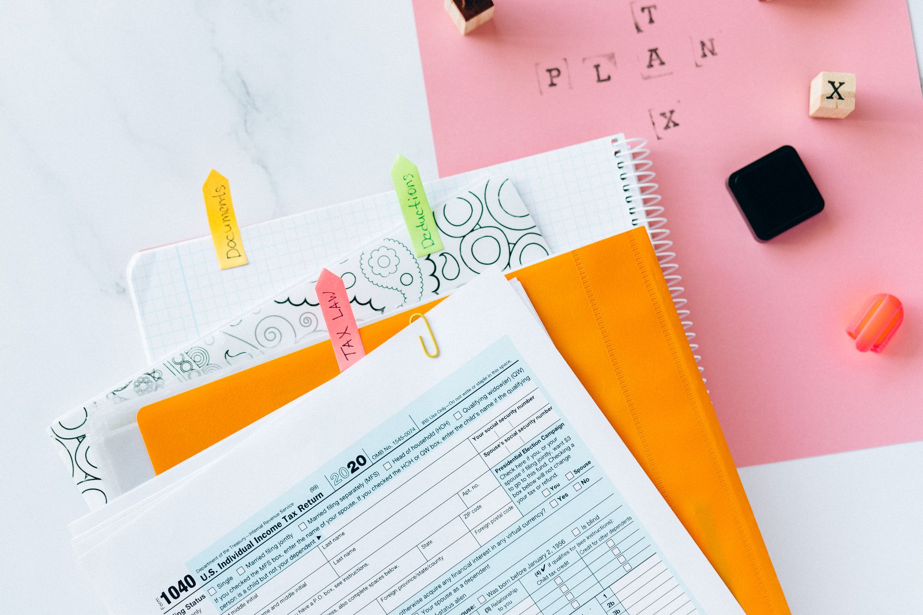 Tax forms and financial documents illustrating alternative minimum tax filing