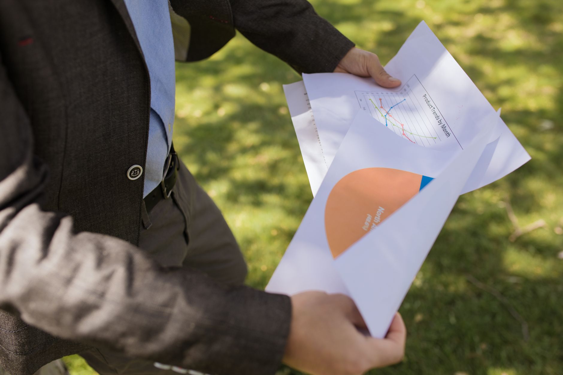 Investor reviewing fixed income portfolio documents and charts