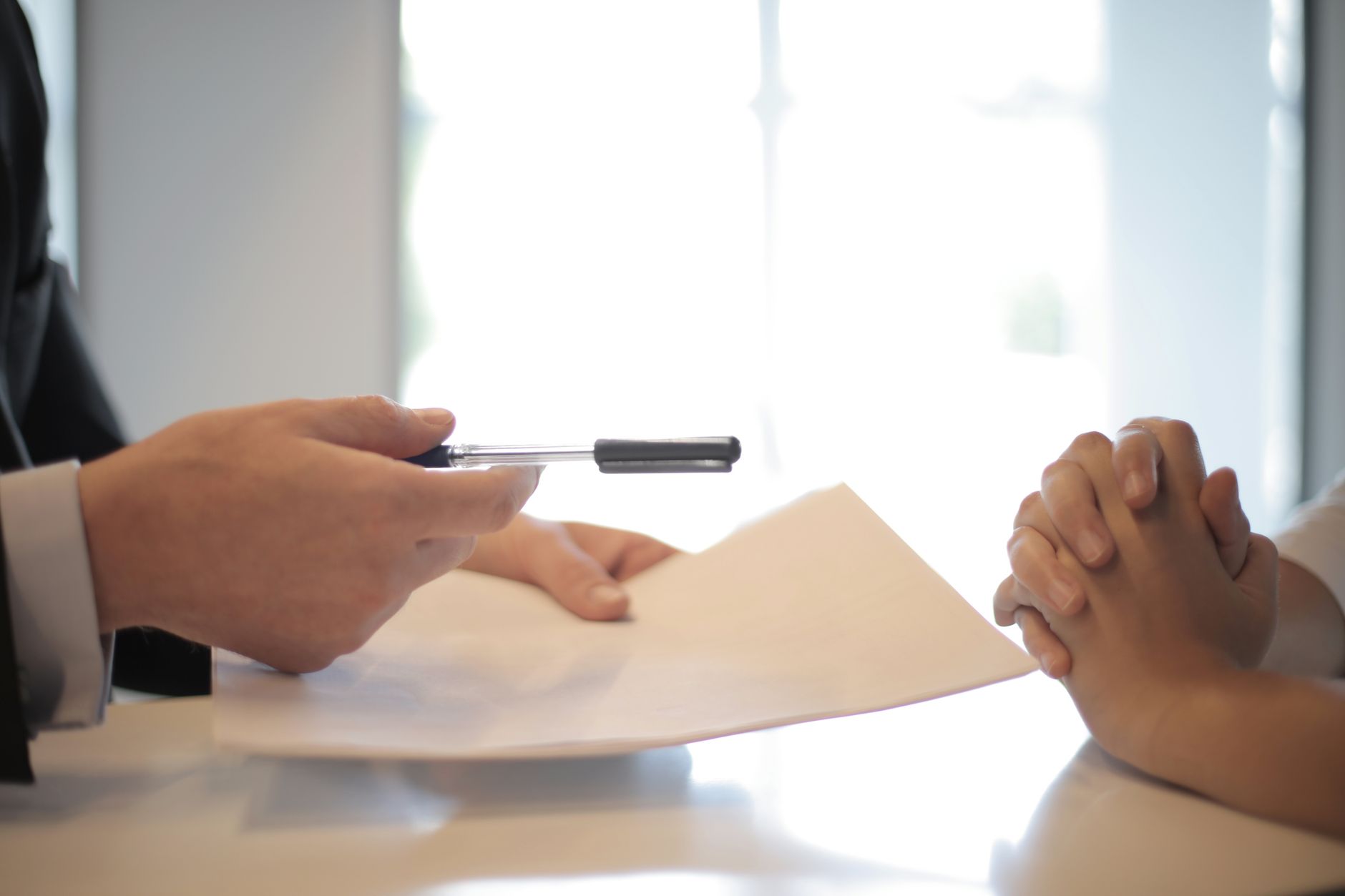 Financial documents and contracts laid out on a desk representing reinsurance agreements
