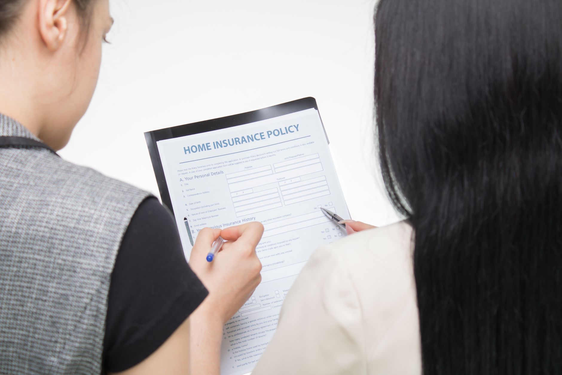 Financial advisor reviewing an annuity contract with a client across a desk
