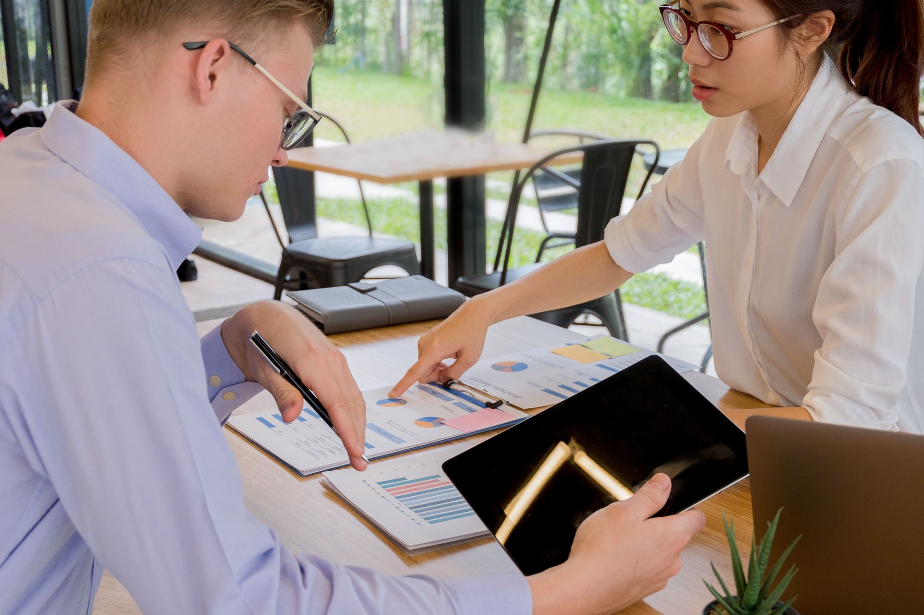 Institutional investors in a meeting discussing portfolio strategy and risk allocation