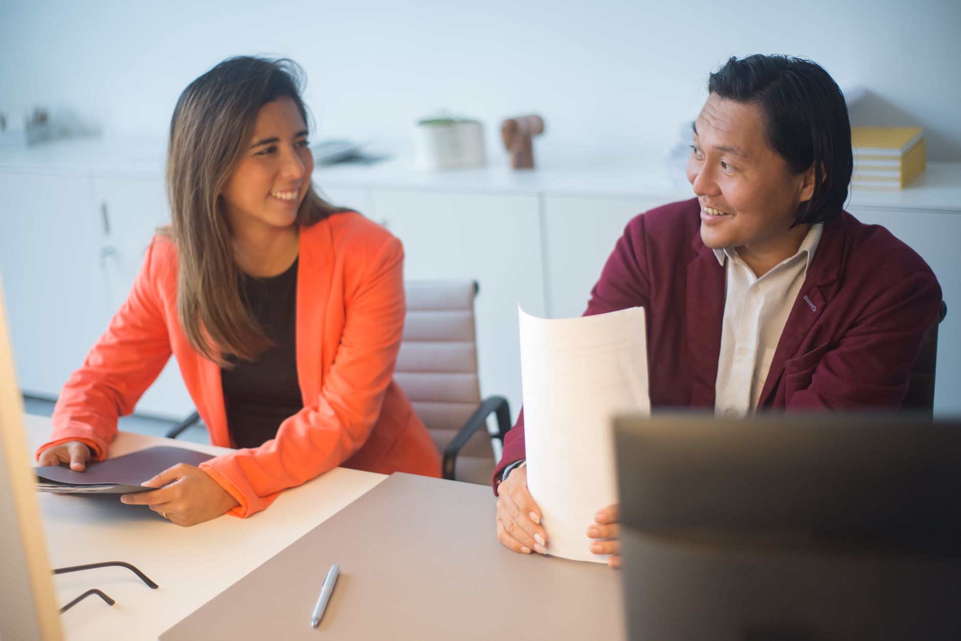 Institutional investors reviewing portfolio documents during an allocation strategy meeting