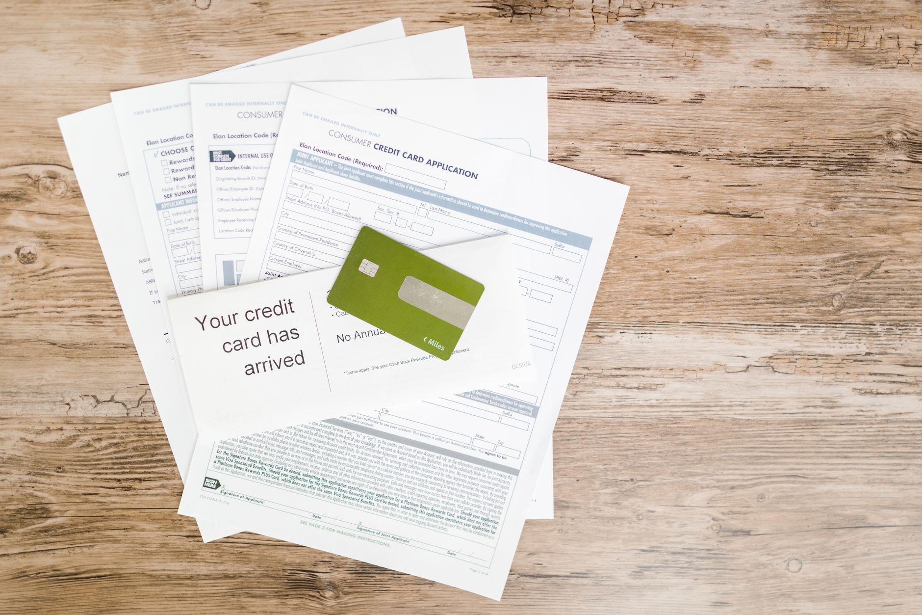Bank loan documents and credit agreement paperwork on a desk