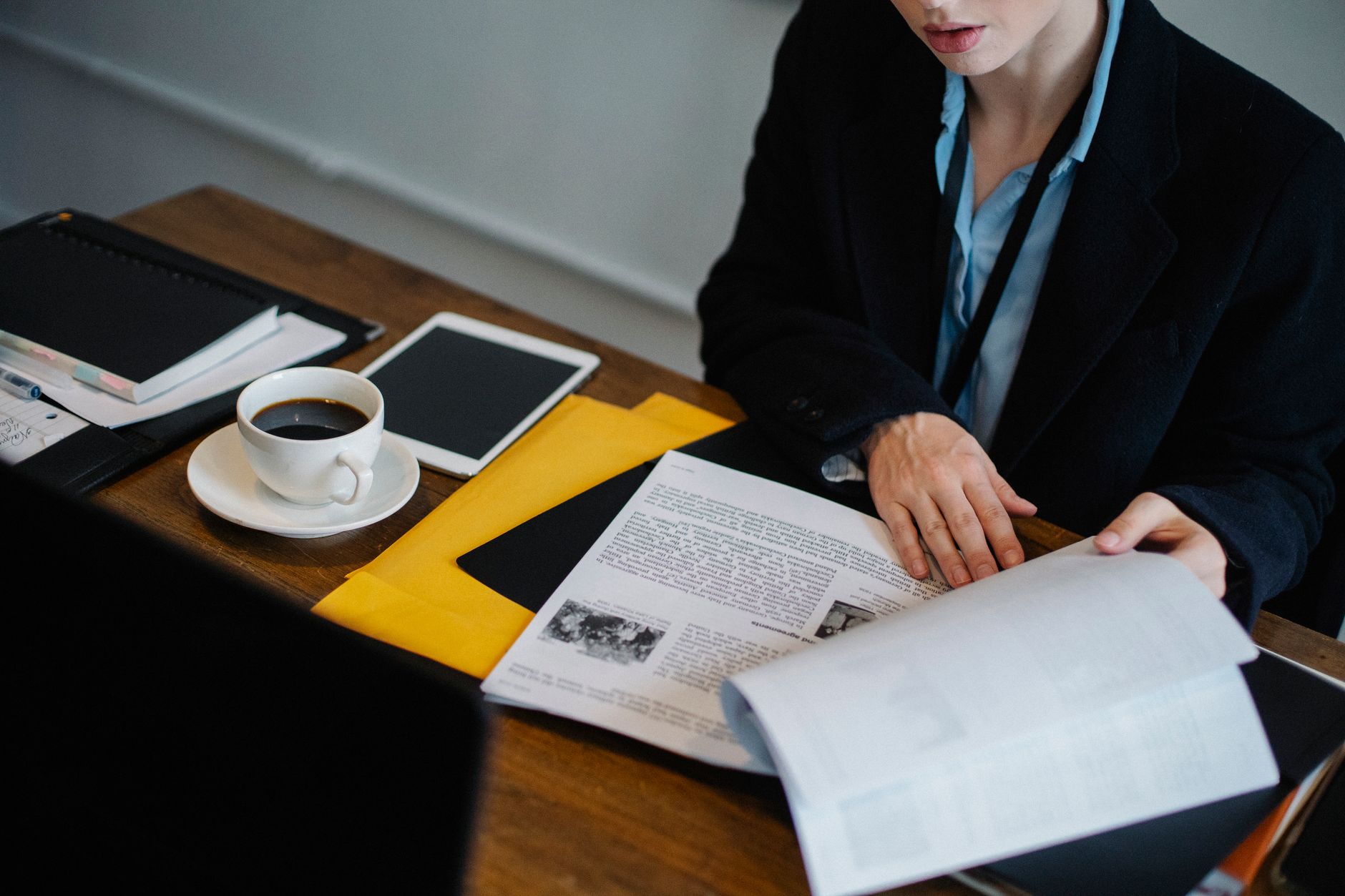 Investor reviewing financial documents related to fixed income and bond portfolio analysis